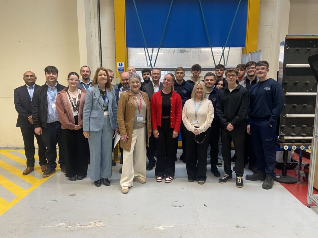 Image of Ashley Dalton MP, apprentices and staff at NSG Group.